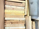 a lot of books in a box on the floor