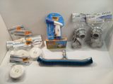 a lot of cleaning supplies sitting on a shelf