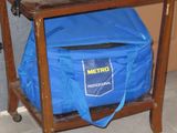 a blue bag sitting on top of a wooden cart