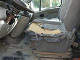 an image of a dirty car with the door open