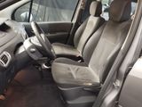 the interior of a car with the front seats up and the passenger seat down