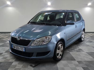 a picture of a blue car parked in a garage