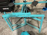 a blue machine that is sitting on the floor