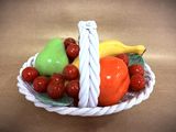 a basket of fruit that is sitting on a table