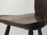 a close up of a wooden chair on a white background