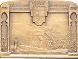 a bronze plaque with a picture of a man on a horse