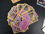 a lot of pokemon cards sitting on a table