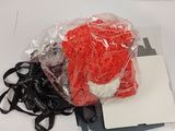 a bag of yarn and scissors on a white surface