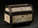 a wooden box with writing on it sitting on a table
