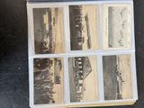 an old photo of a bunch of old photos on a table