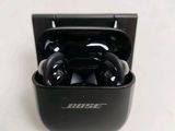 a black case with a pair of bluetooths in it