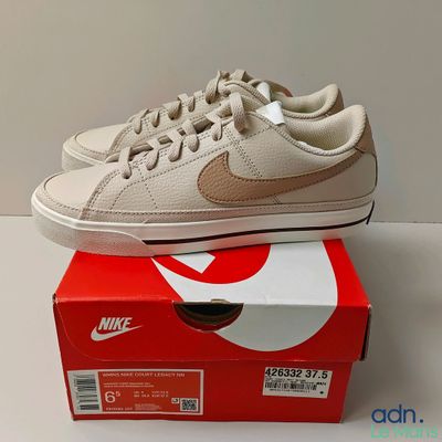 a pair of shoes that are on top of a box