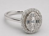 a close up of a diamond ring on a white background