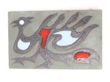 a picture of a tile with a bird design on it