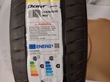 a close up of a tire on a bed with a label on it