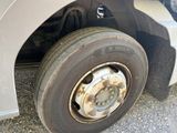 a flat tire on the side of a truck