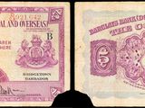 une image représentant deux anciens billets de banque indiens, l'un violet et l'autre blanc