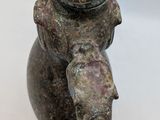 an image of a close up of a statue of an elephant on a white surface