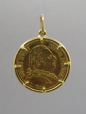 a gold coin with a portrait of a man on it