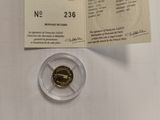 a small piece of gold coin on the table