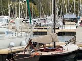 many boats that are docked in the water at the dock