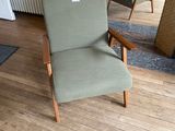 a chair that is sitting in the middle of a room