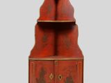 une image représentant une armoire rouge à deux portes et deux tiroirs