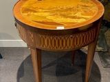 a small table with a wooden top on a carpeted floor