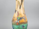 a glass vase that is sitting on a stand