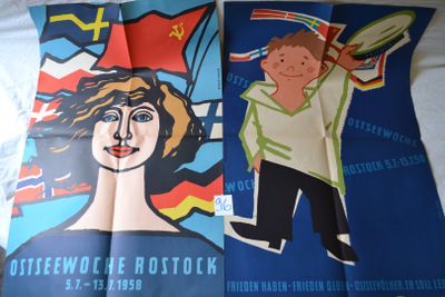 two posters of a man and a woman on a bed