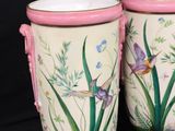 two vases that are decorated with flowers and birds