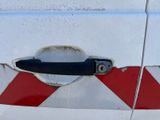 an image of a close up of a door handle on a van