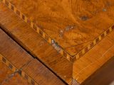 a close up of a wooden table with a clock on it