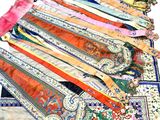 a lot of ties that are laying on a table