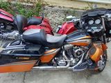two motorcycles parked next to each other in a garage