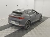 the rear end of a gray car parked in a garage