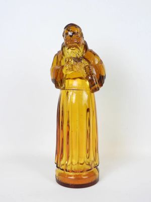 a glass figurine of a man with a beard
