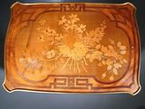 a tray with flowers on it sitting on a table
