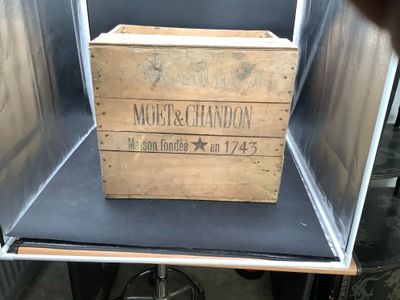 a wooden box that is sitting in the middle of a table