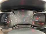 a close up of a car dashboard with a speedometer and gauges