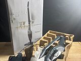 a box of tools on a table next to a box of scissors