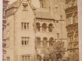 an old photo of a building with a clock tower