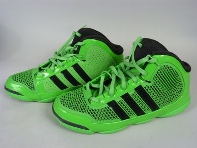 a pair of neon green adidas sneakers on a white background