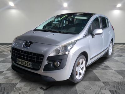 a silver car that is parked in a room