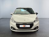 the front view of a white car in a showroom