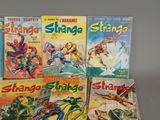 a lot of comic books that are on the table