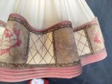 a close up of a dress with a bow on it