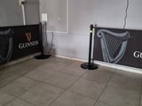 a picture of a room with a guinness sign on the wall
