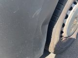 a close up of a car ' s tire with a hole in the tire