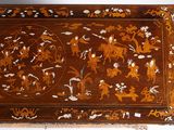 a wooden box with a floral design on it
